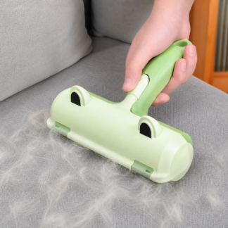 frog shaped pet hair remover brush cleaning a sofa