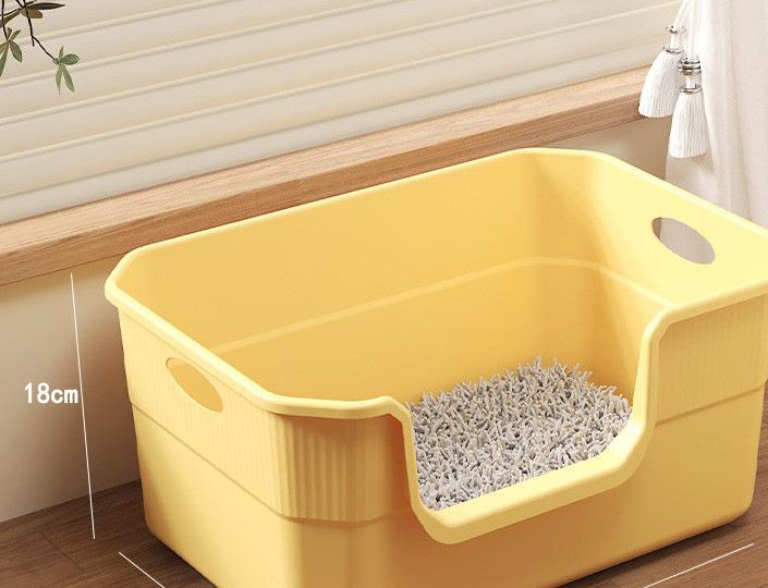Small open low-front cat litter box in yellow
